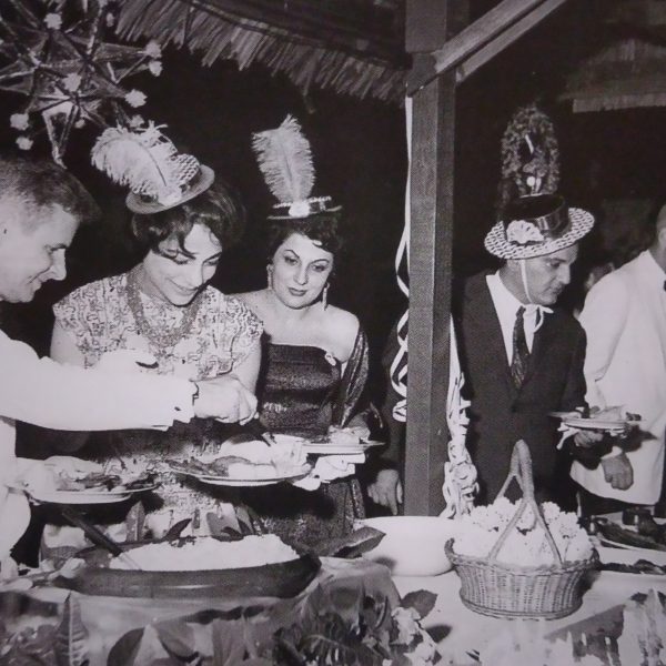 Guests at the New Year's Eve Dinner in 1960 admire the buffet spread.