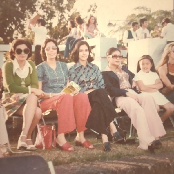 By the 1970s, women's attire had become more casual - flared pants, sandals or open-toed platform shoes, and large sunglasses.