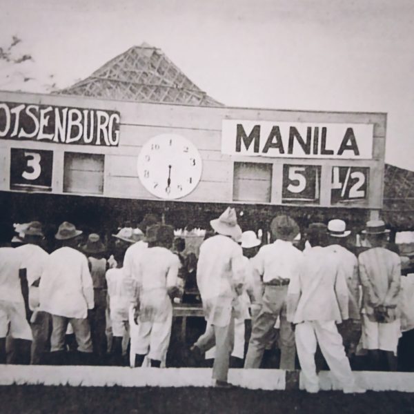 The curious but uninvited check the scoreboard of a tournament exhibition in February 1919.